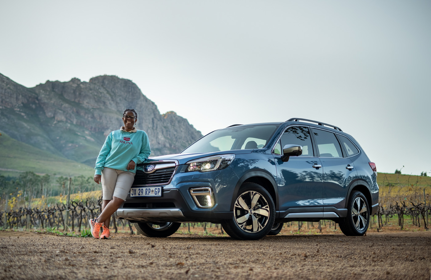 Woman Leaning On Subaru Forester